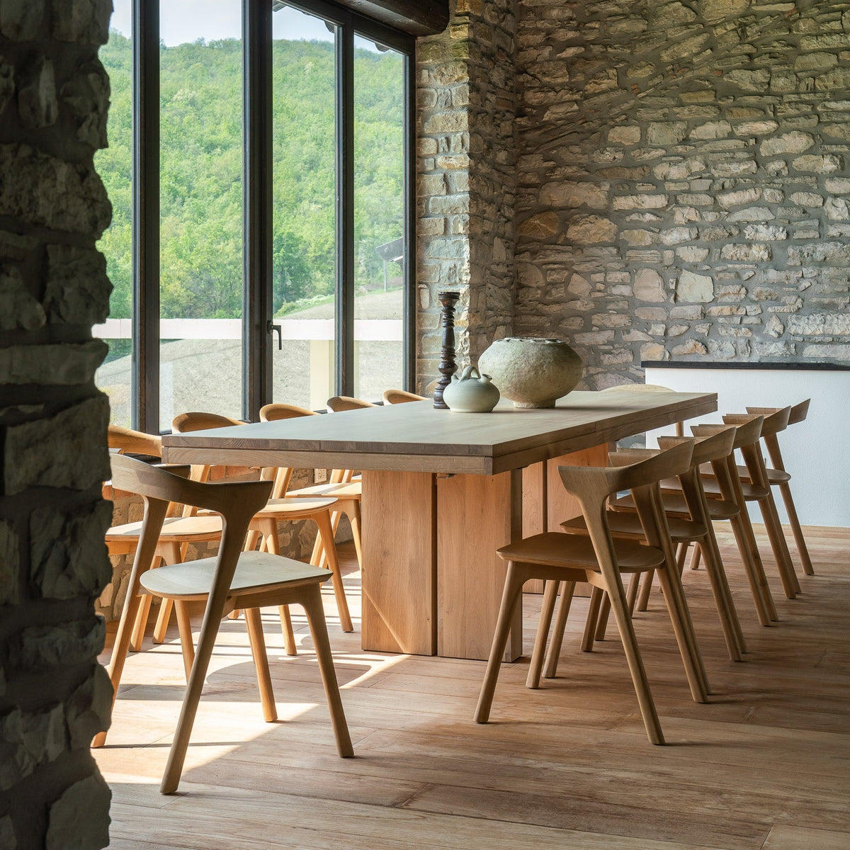 Ethnicraft Double extendable dining table in solid oak with Bok dining chairs, extended for a large dinner