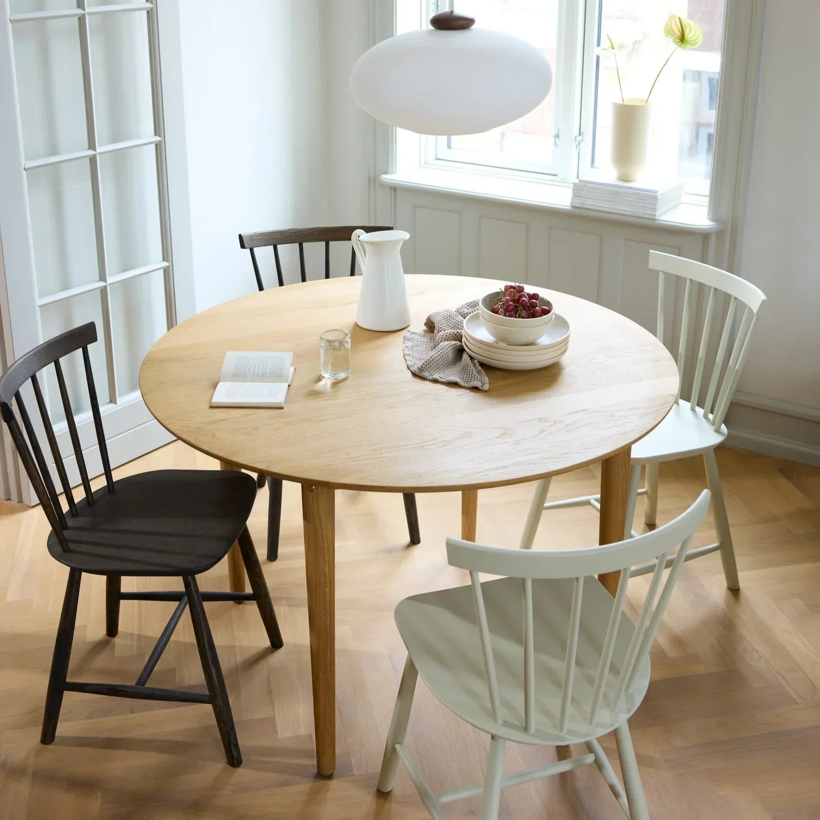 An FDB Møbler J46 dining chair in smoked solid oak, designed by Poul M. Volther, from the Danish furniture collection at Comosum.