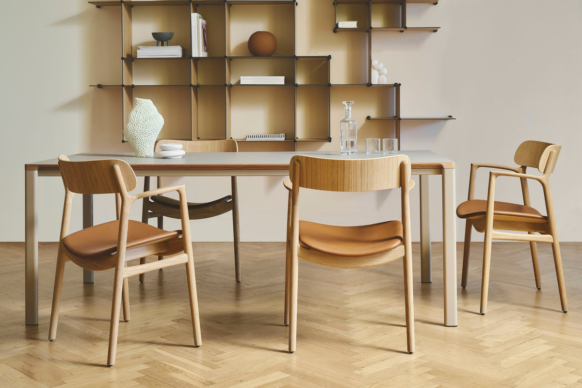 Bent Hansen Asger dining chairs in oiled oak and cognac leather around a dining table