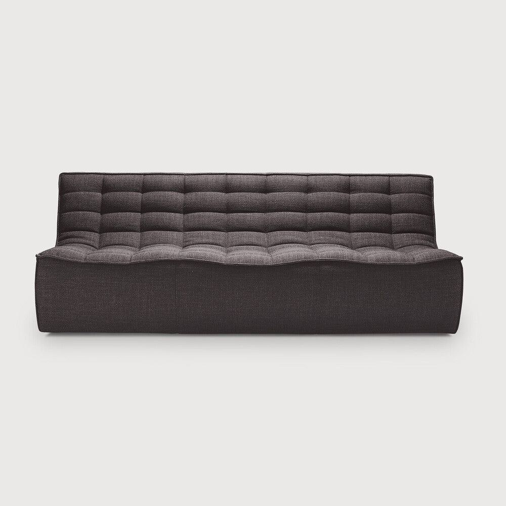 Modern dark grey tufted sofa by Ethnicraft, eco friendly furniture crafted with Comosum design