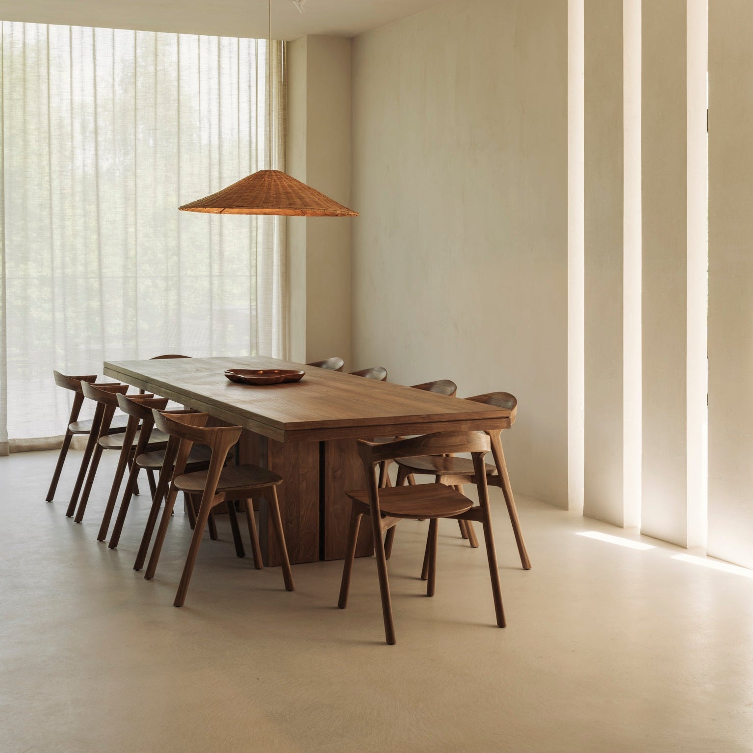 Ethnicraft Double Extendable Dining Table in teak styled in a dining room