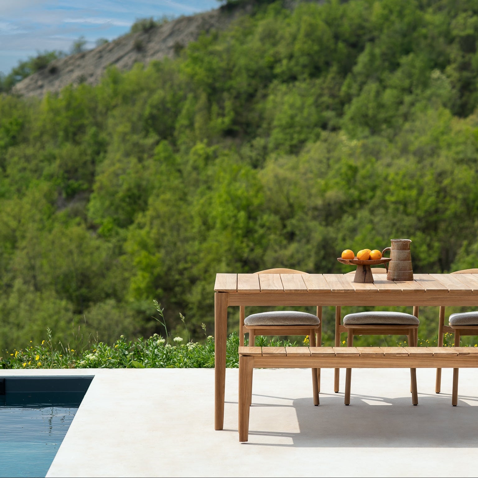 Ethnicraft Bok Outdoor Bench styled in a dining room