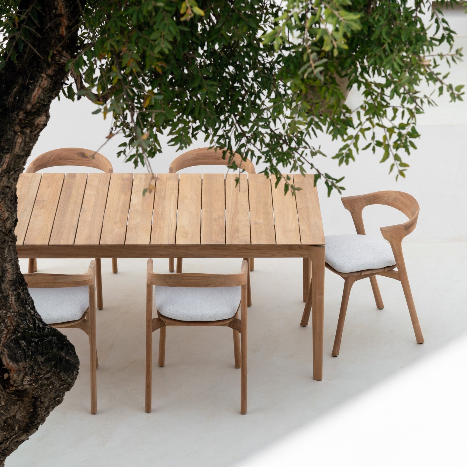 Ethnicraft Bok Outdoor Dining Chair Cushion styled in a dining room