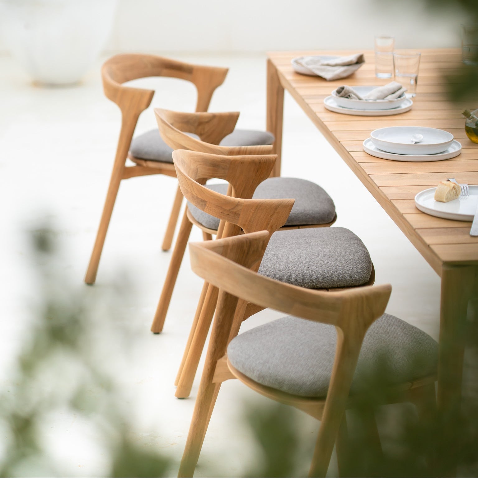 Ethnicraft Bok Outdoor Dining Chair Cushion styled in a dining room