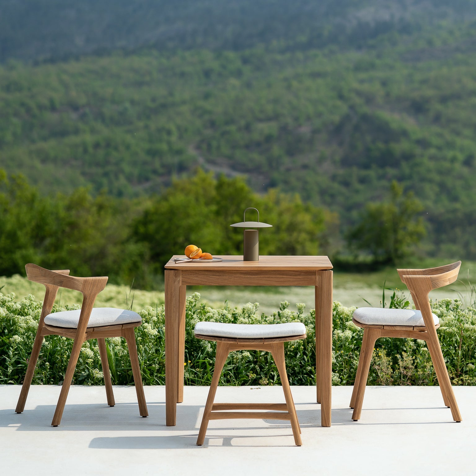 Ethnicraft Osso outdoor stool styled in a dining room