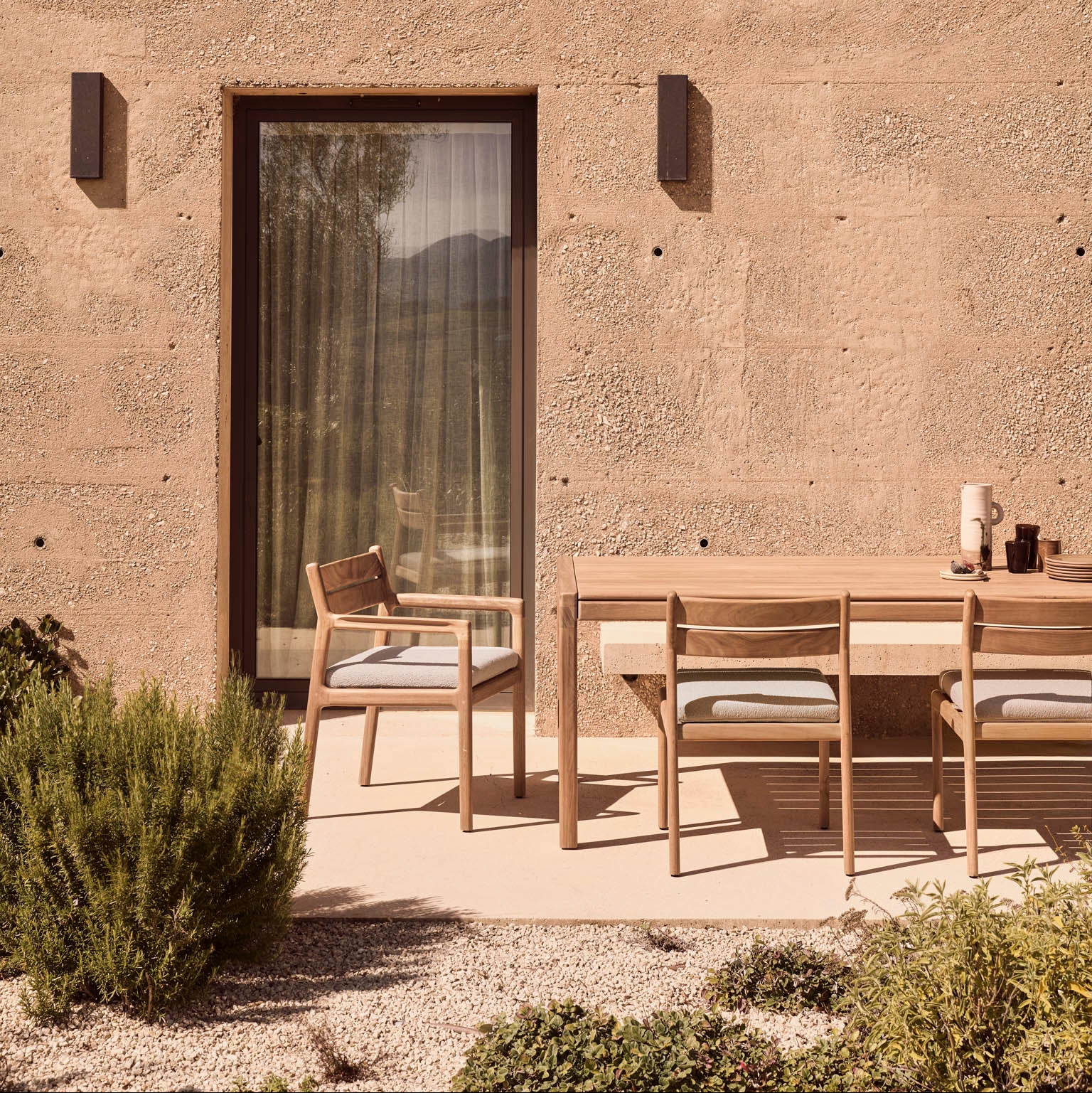 Ethnicraft Jack Outdoor Dining Chair styled in a dining room