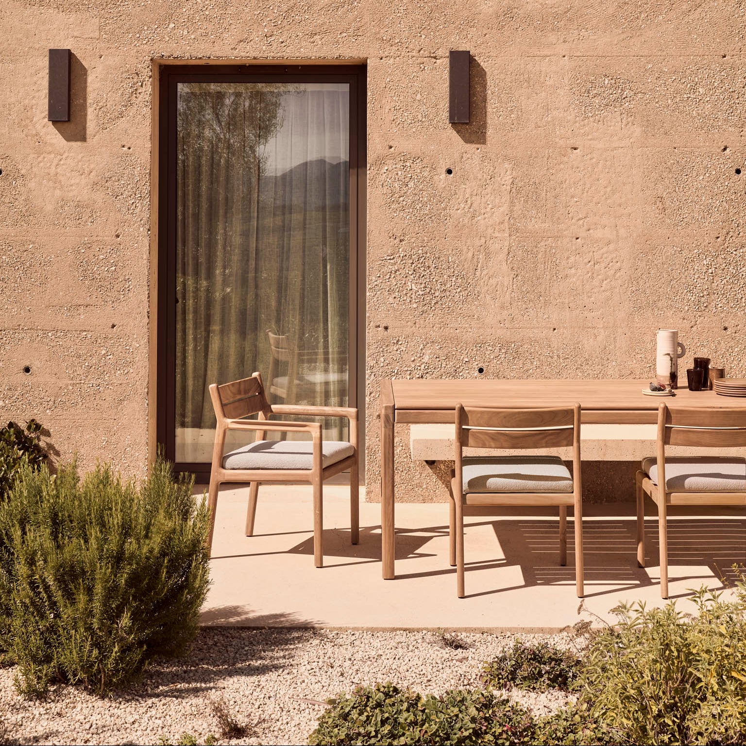 Ethnicraft Jack Outdoor Dining Chair Frame styled in a dining room