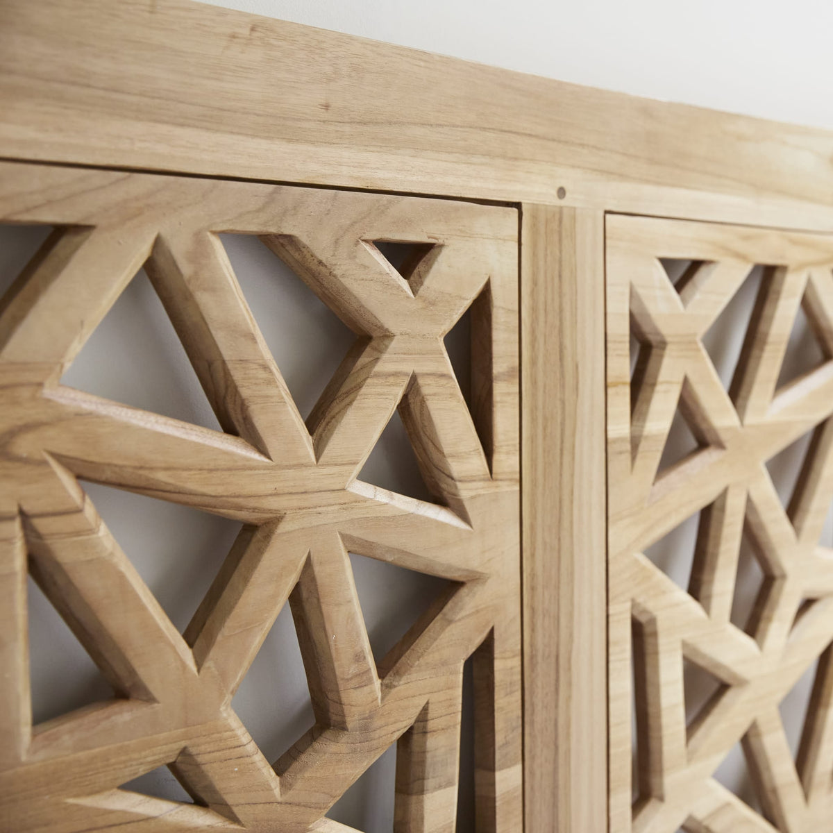 Tikamoon Gentong king size headboard in solid teak, angled view