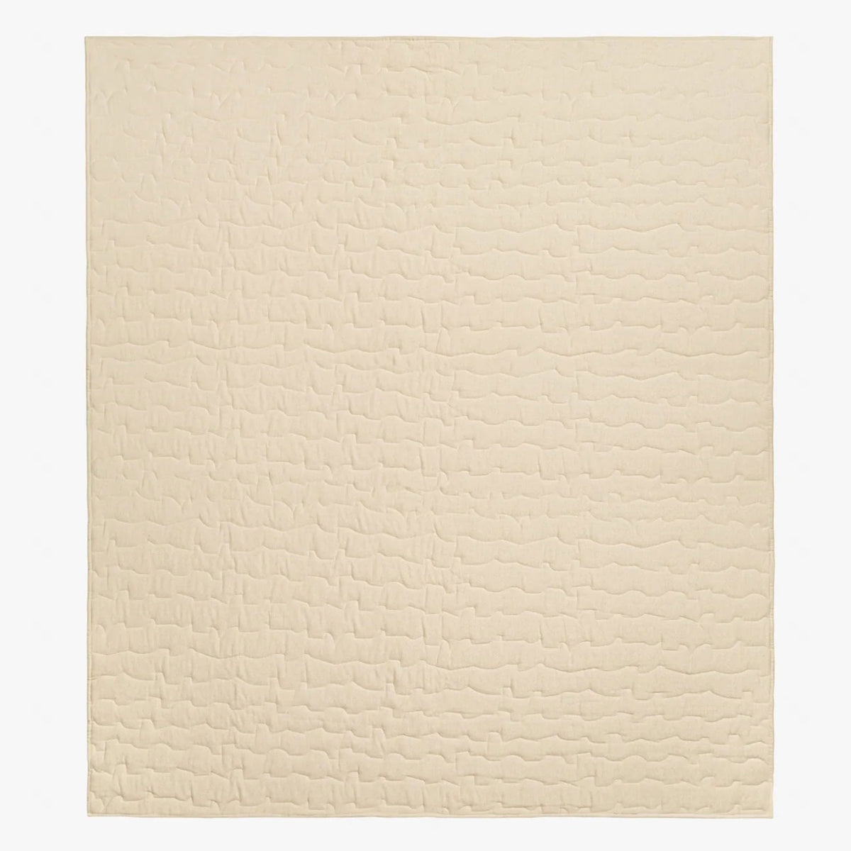 Case Ripple quilt in off-white laid flat, showing its rippled stitching