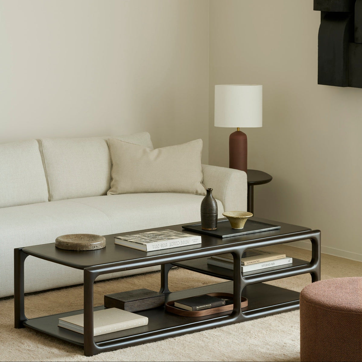 Ethnicraft Eda Coffee Table rectangular in Rose Brown, styled in an interior setting, solid mahogany