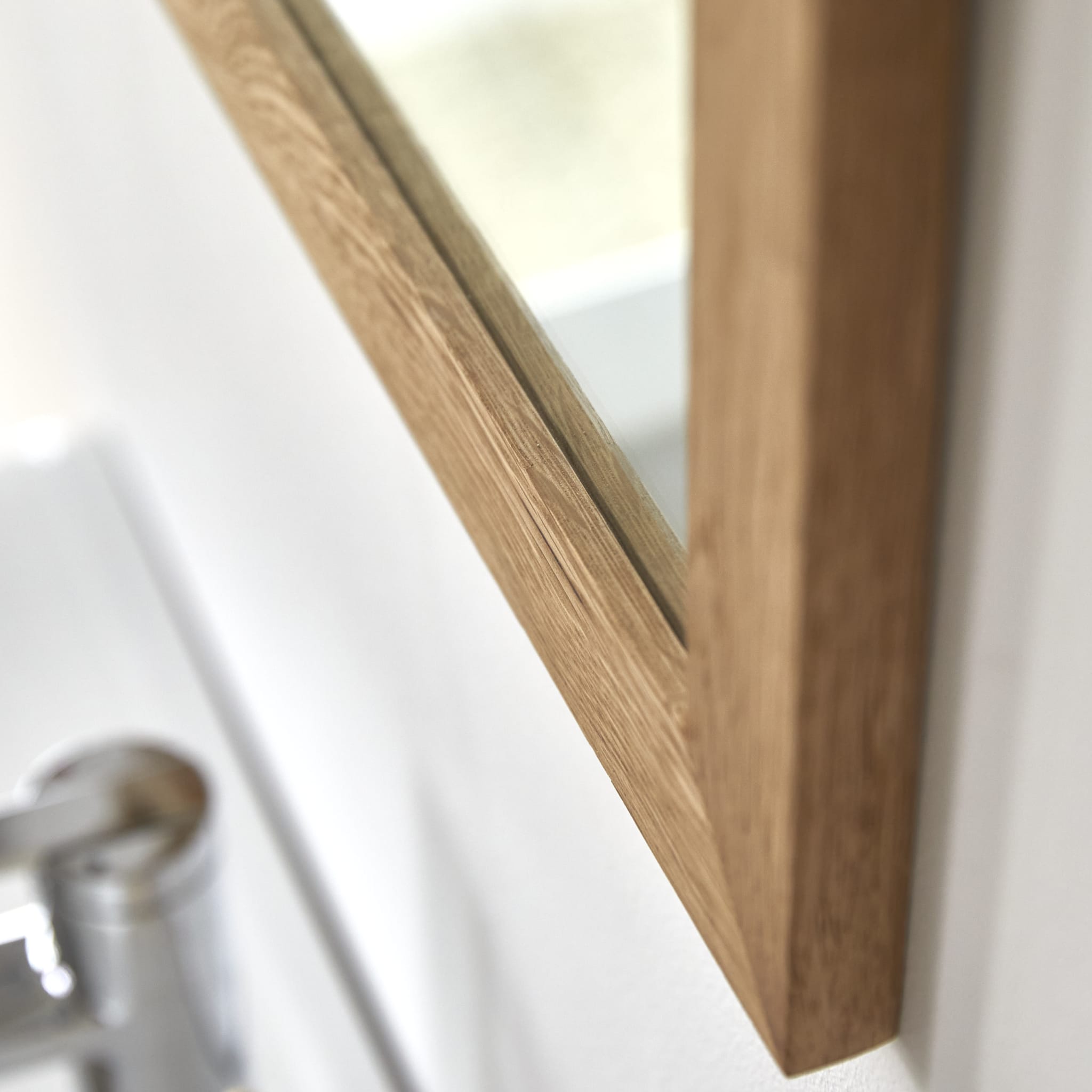 Serena mirror hung horizontally in a bathroom setting