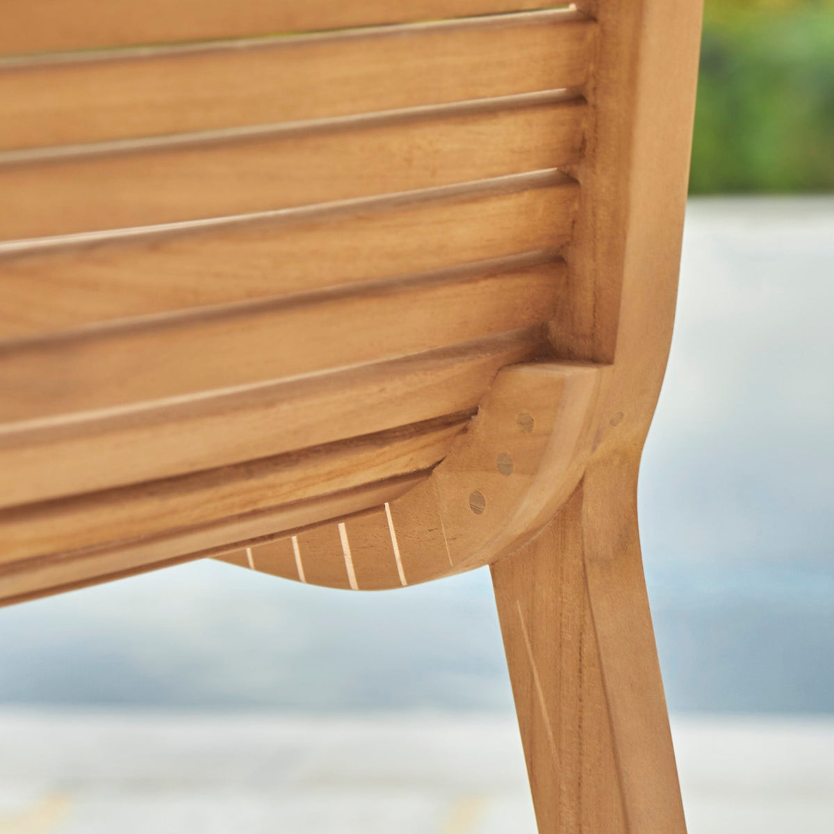 Tikamoon Teo outdoor dining chair in solid teak, close-up of the seat slats