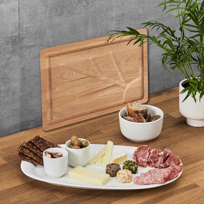 Kähler Hammershøi Bowls by Hans-Christian Bauer, styled on a dining table, B Corp certified Danish ceramic since 1839.