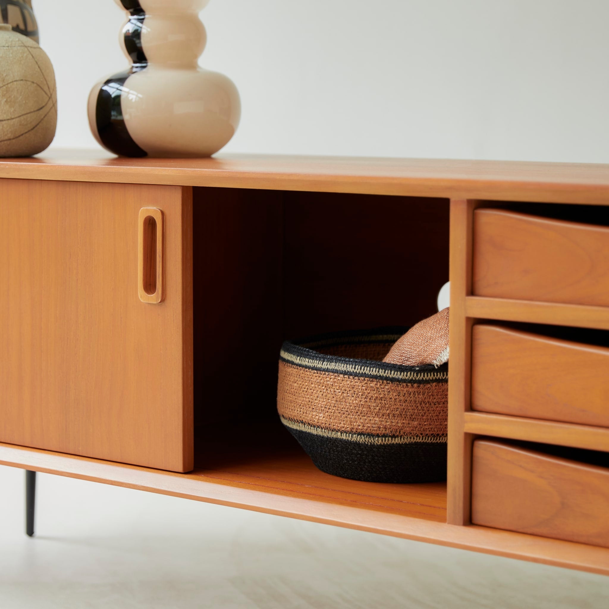Simen mahogany TV stand, close-up of drawer and sliding door hardware