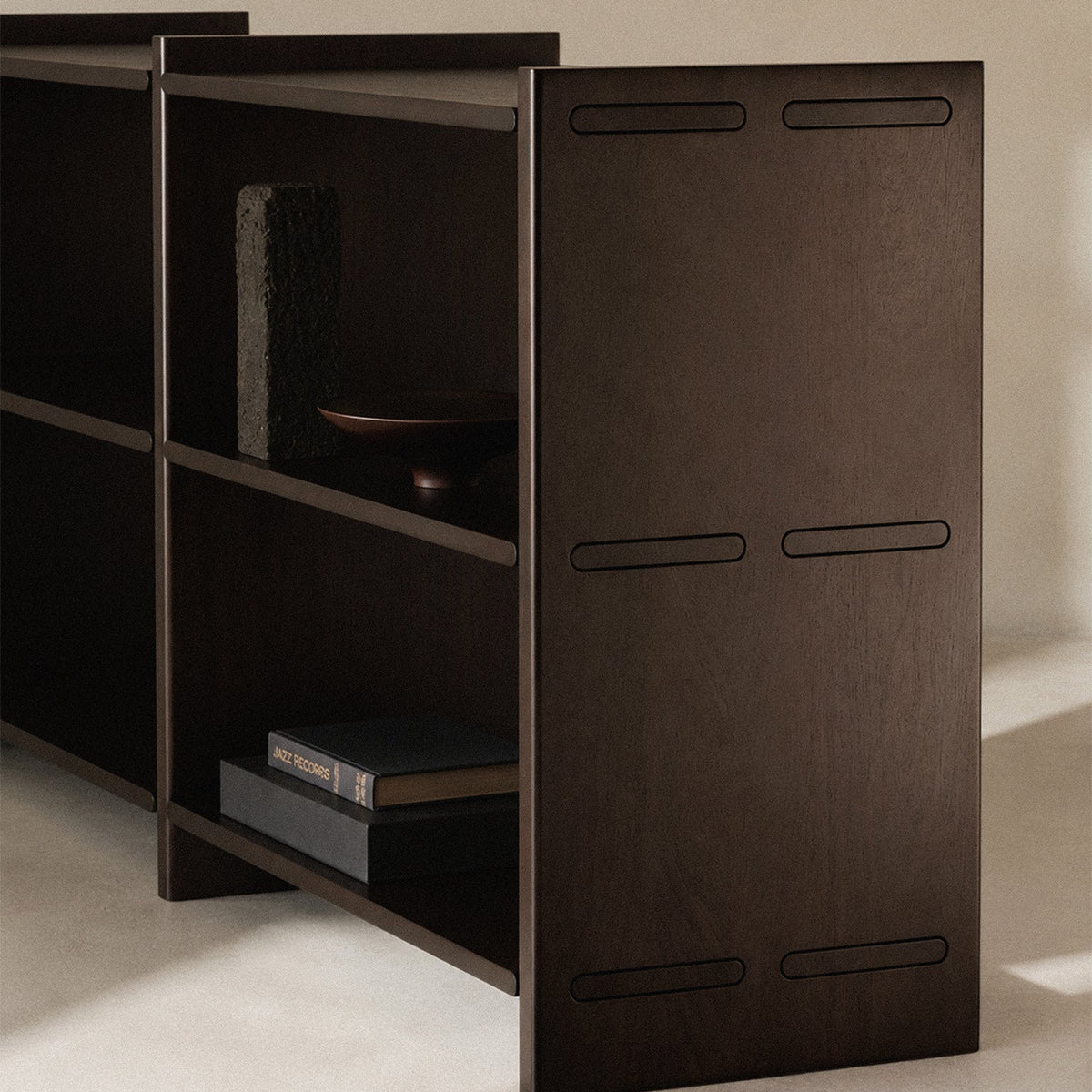 Ethnicraft Mortise Rack in Rose Brown, styled in an interior setting, solid mahogany