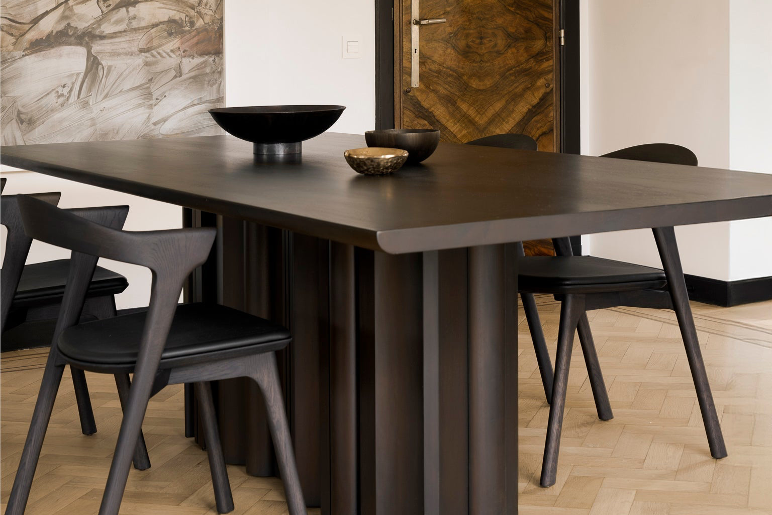 Ethnicraft Sequence Dining Table in mahogany styled in a dining room