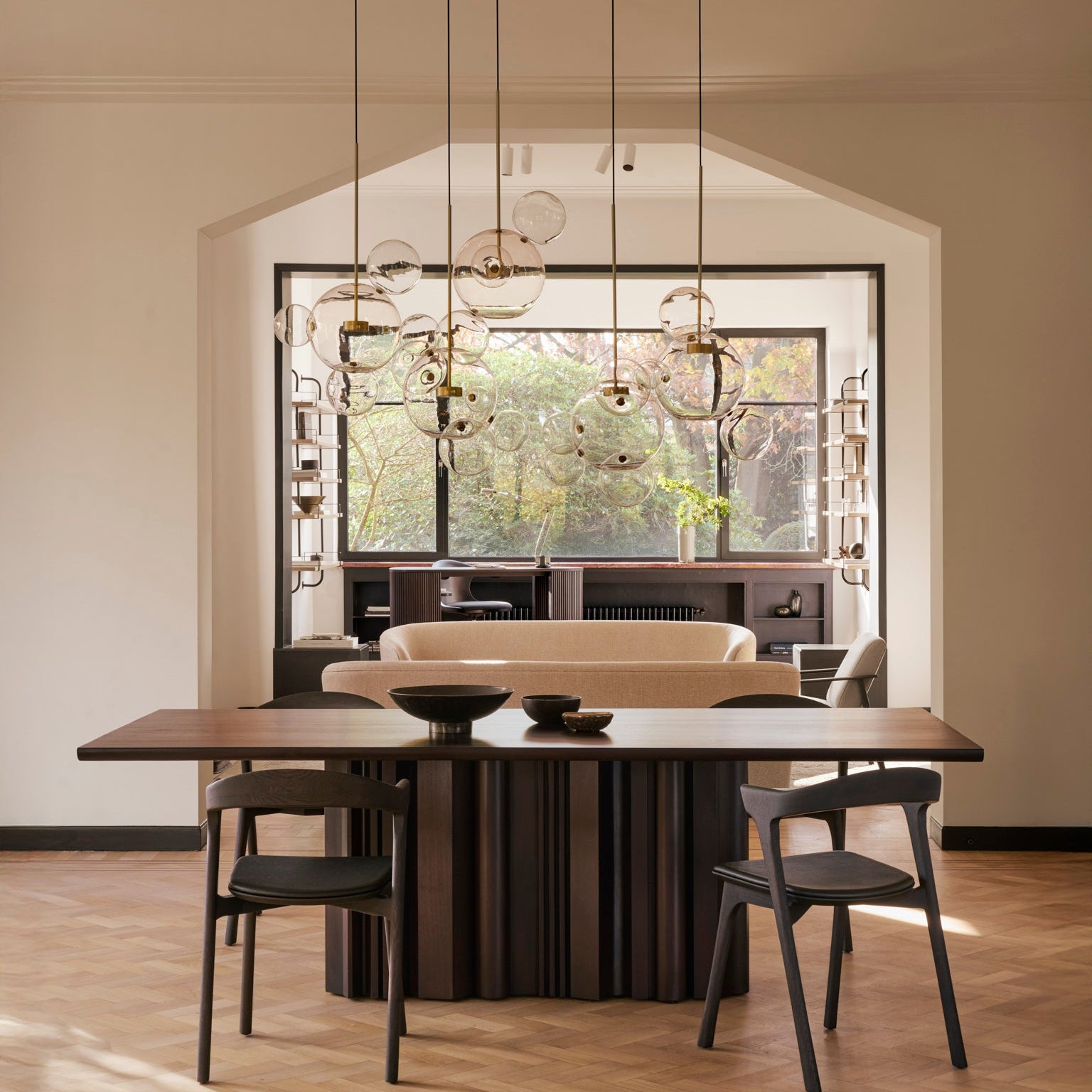 Ethnicraft Sequence Dining Table in mahogany styled in a dining room