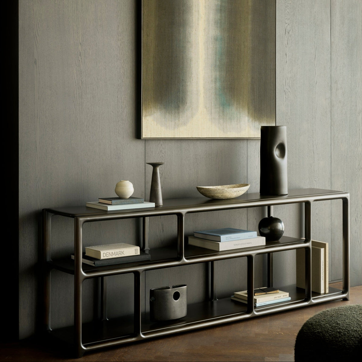 Ethnicraft Eda Rack low in Rose Brown with Orb pouf, styled in a living room, solid mahogany