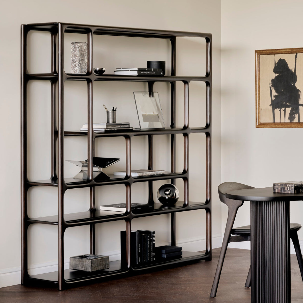 Ethnicraft Eda Rack tall in Rose Brown with Bok dining chair, styled in an interior setting, solid mahogany