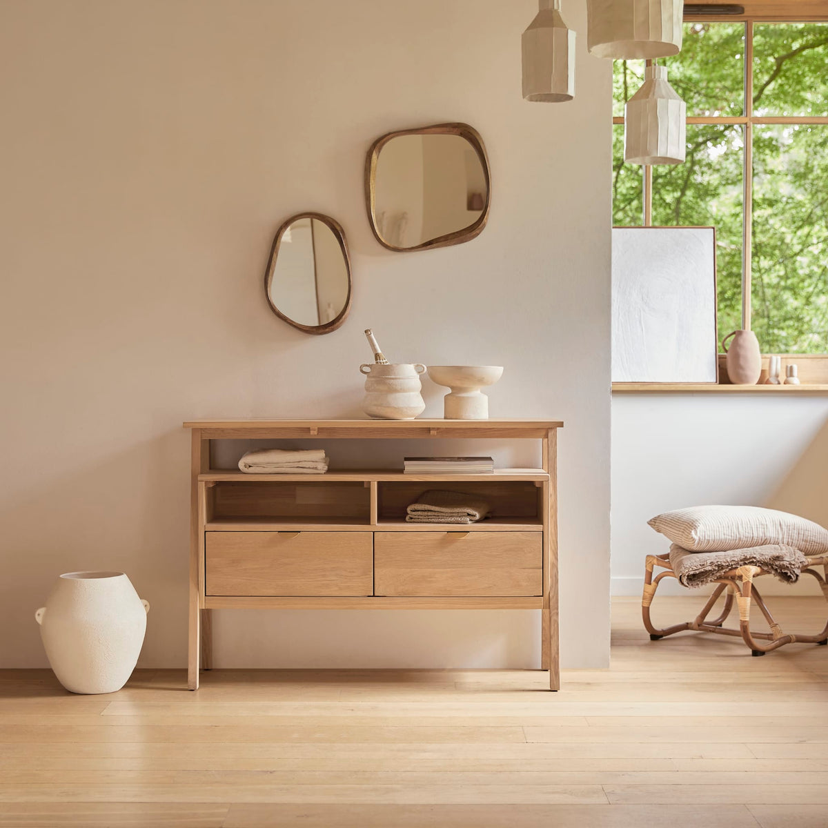 Tikamoon Pola 2-drawer console table in solid oak, angled view