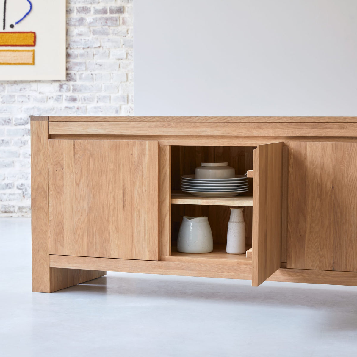 Tikamoon Eden sideboard in solid oak, front view of the 82.7-inch width