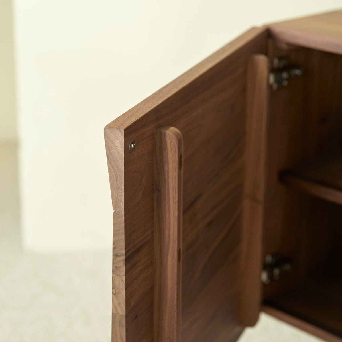 Tikamoon Metric sideboard in solid walnut, detail of a door front