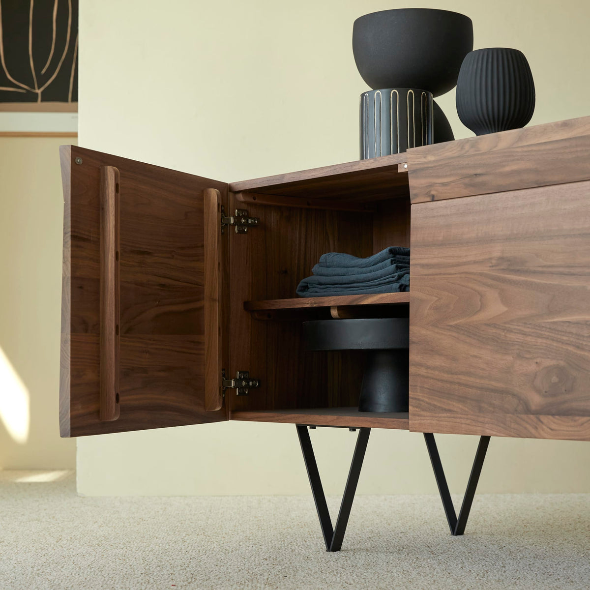Tikamoon Metric sideboard in solid walnut, detail of the metal legs