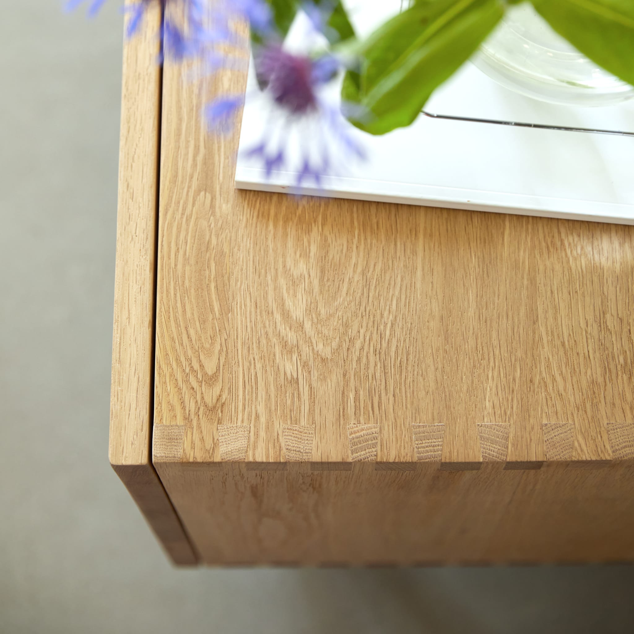 Tikamoon Jeanne TV stand in solid oak, three-quarter view