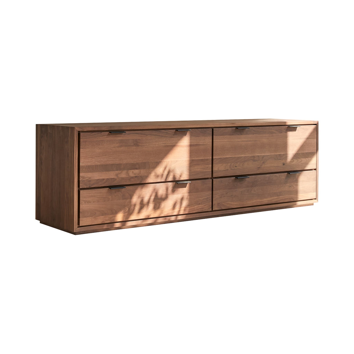 Tikamoon Senson TV stand in solid walnut, in a styled living room with decor