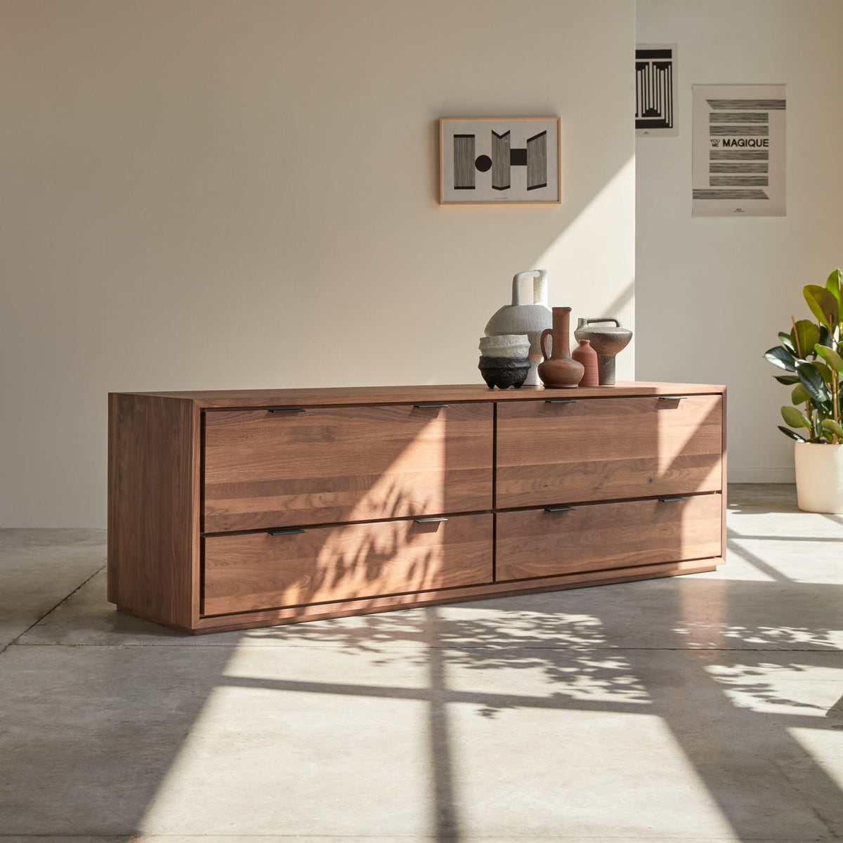 Tikamoon Senson TV stand in solid walnut, three-quarter view from the left