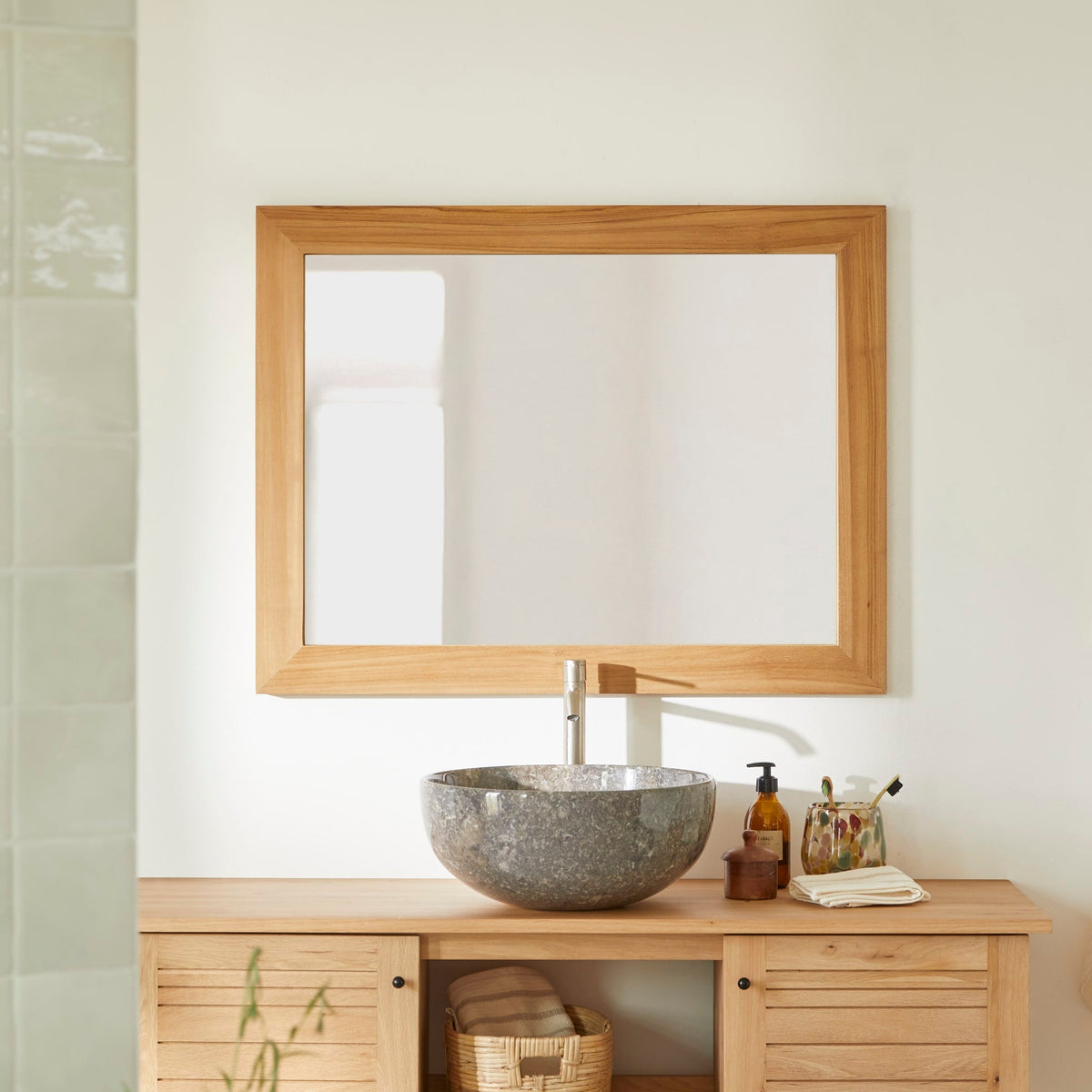 Tikamoon Tona teak mirror hung horizontally above a bathroom vanity