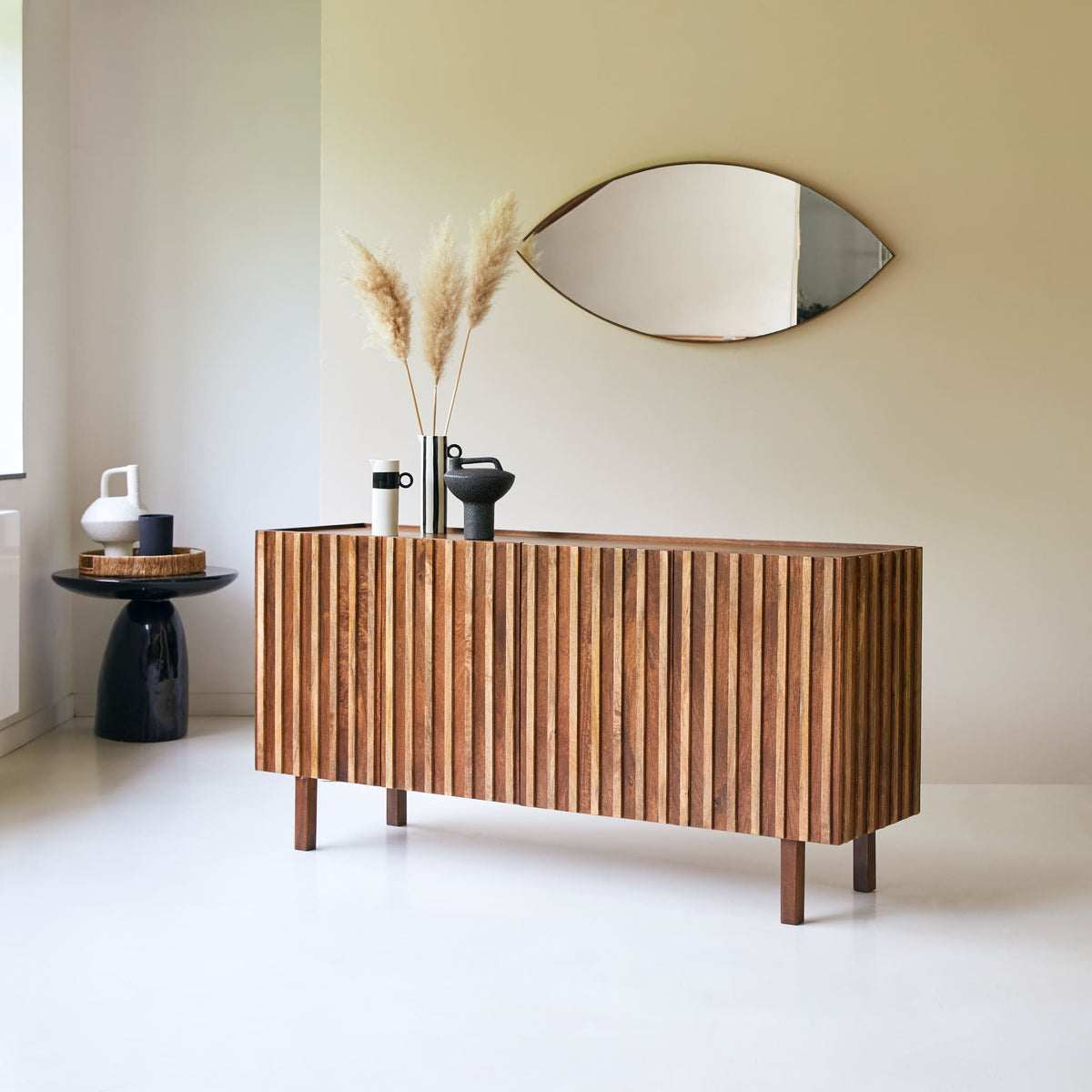 Tikamoon Milo sideboard in solid mango wood, angled view