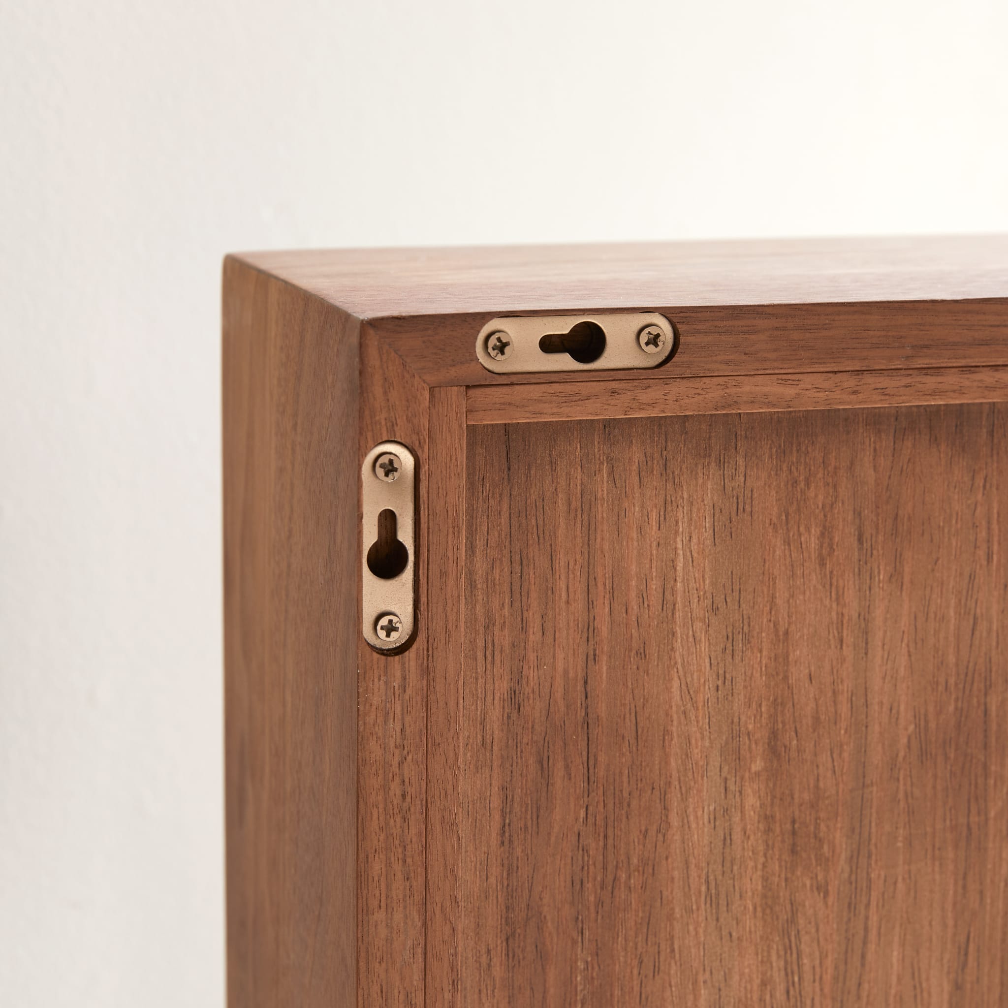 Stelle walnut mirror hung horizontally in a bathroom