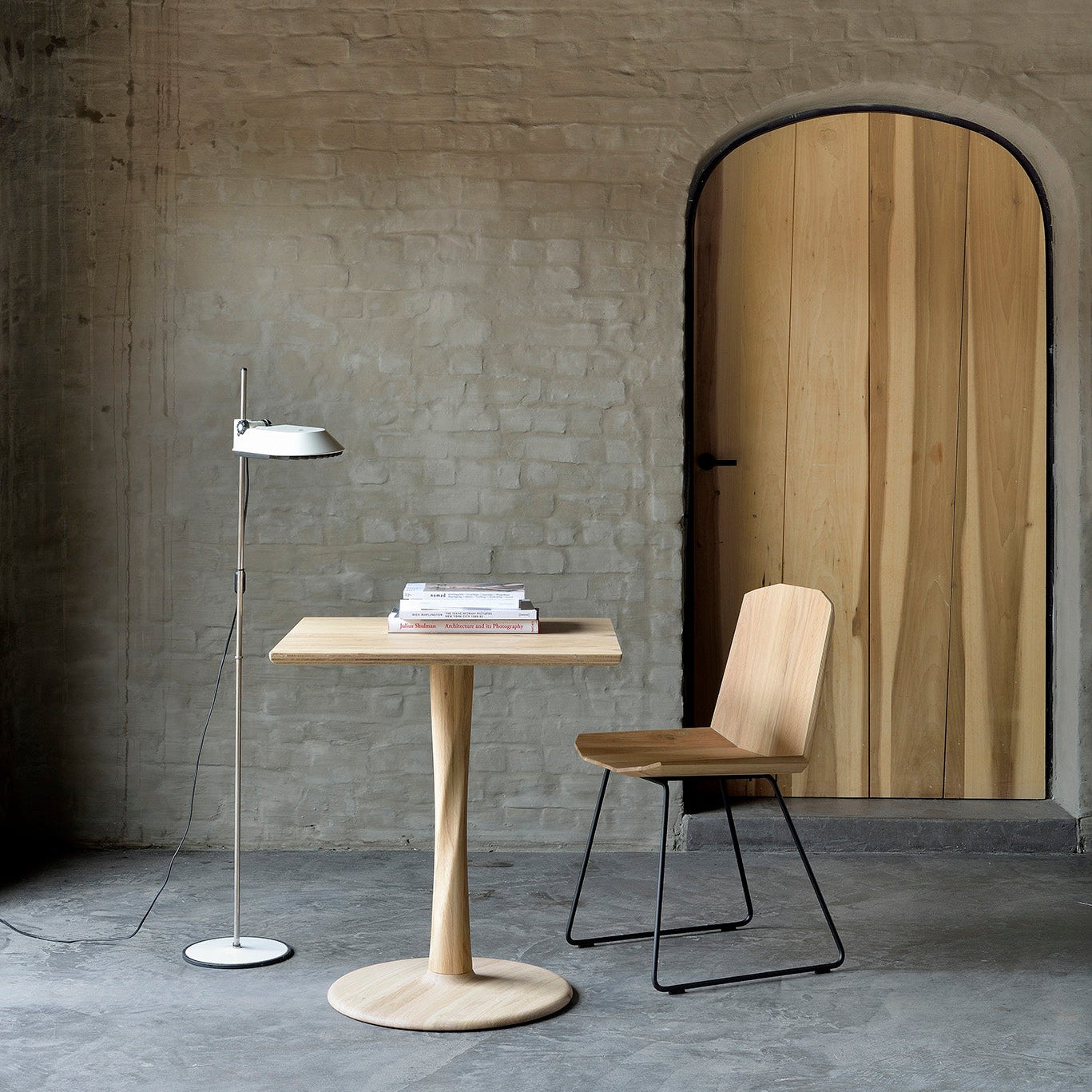 Ethnicraft Torsion Square Dining Table in oak styled in a dining room