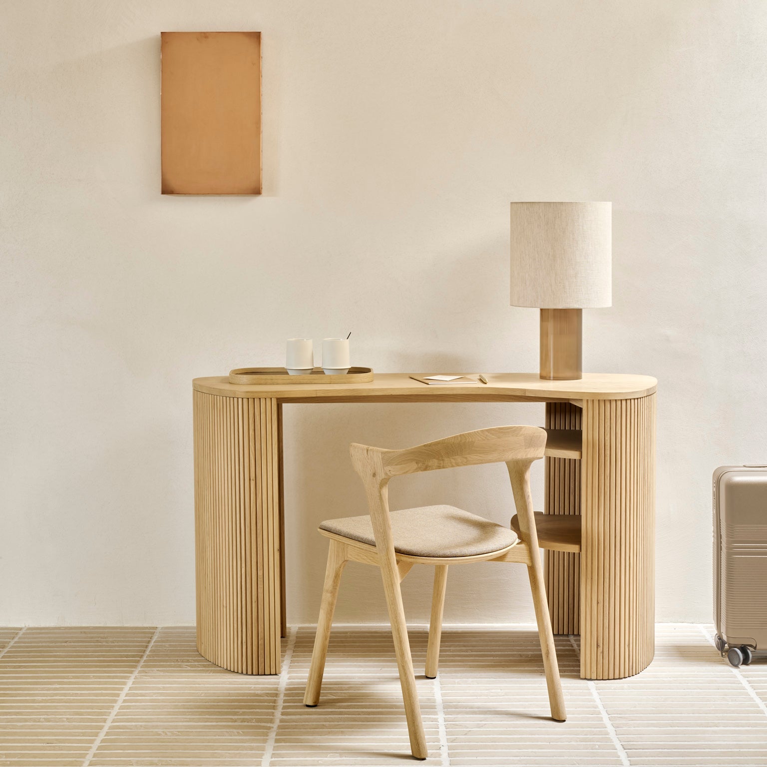 Ethnicraft Roller Max Desk in oak styled in a dining room