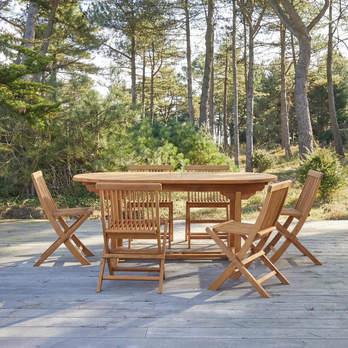 Tikamoon Capri oval outdoor dining set in solid acacia, angled view
