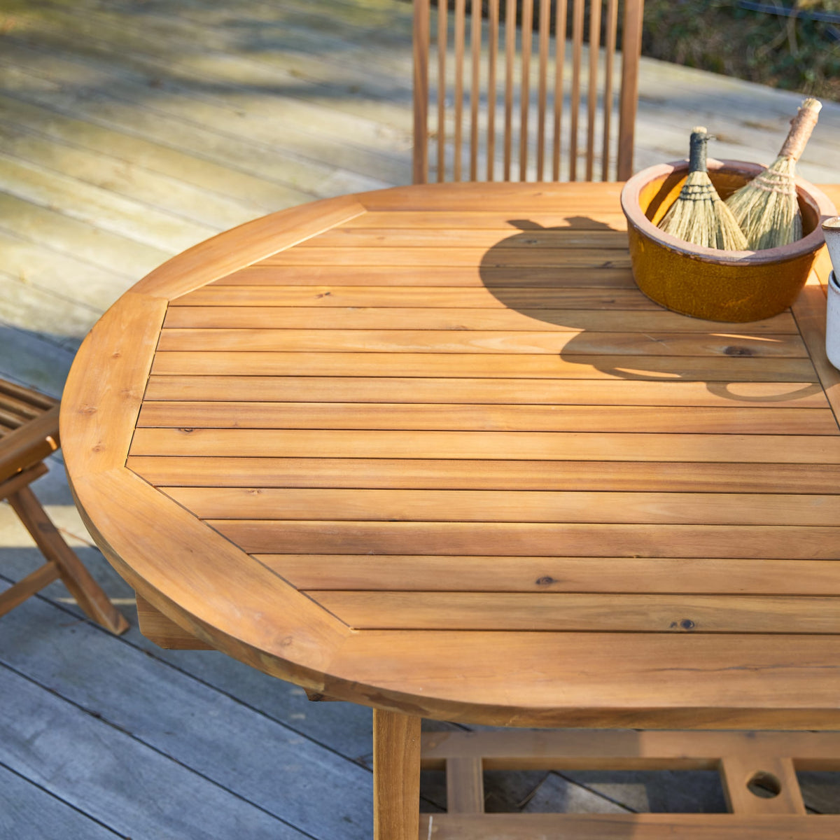 Tikamoon Capri oval acacia dining table, overhead view of the slatted top