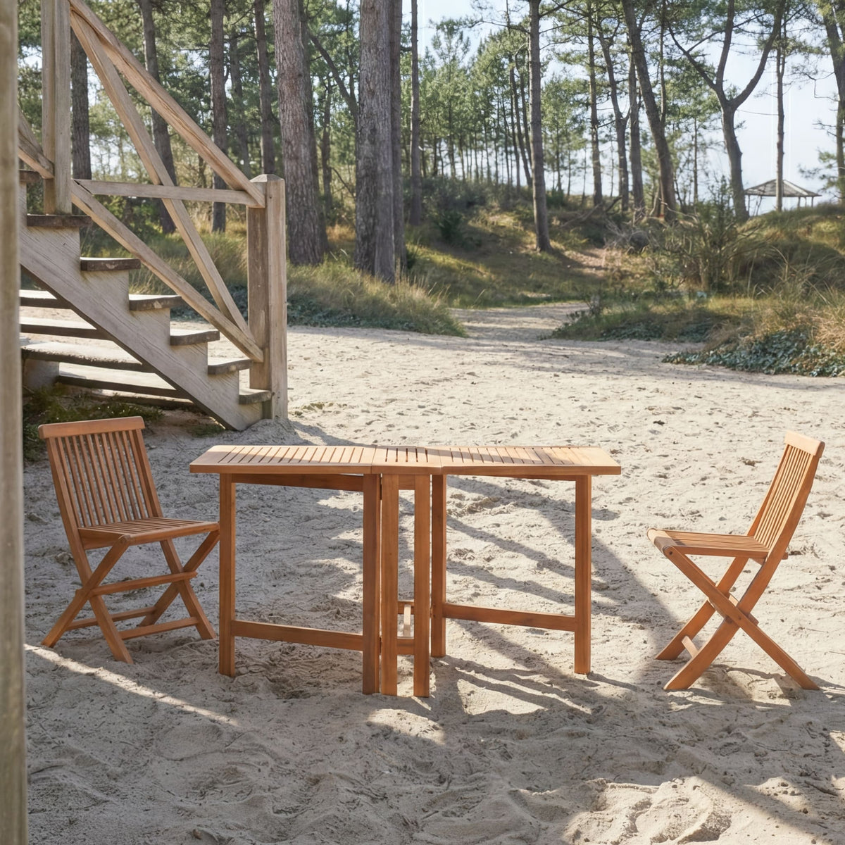 Tikamoon Capri folding garden table in solid acacia, angled view