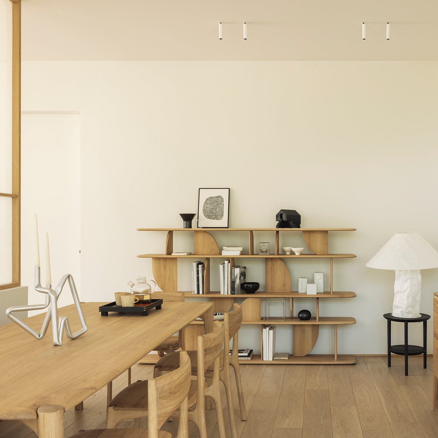 Ethnicraft Geometric Rack in oak styled in a dining room
