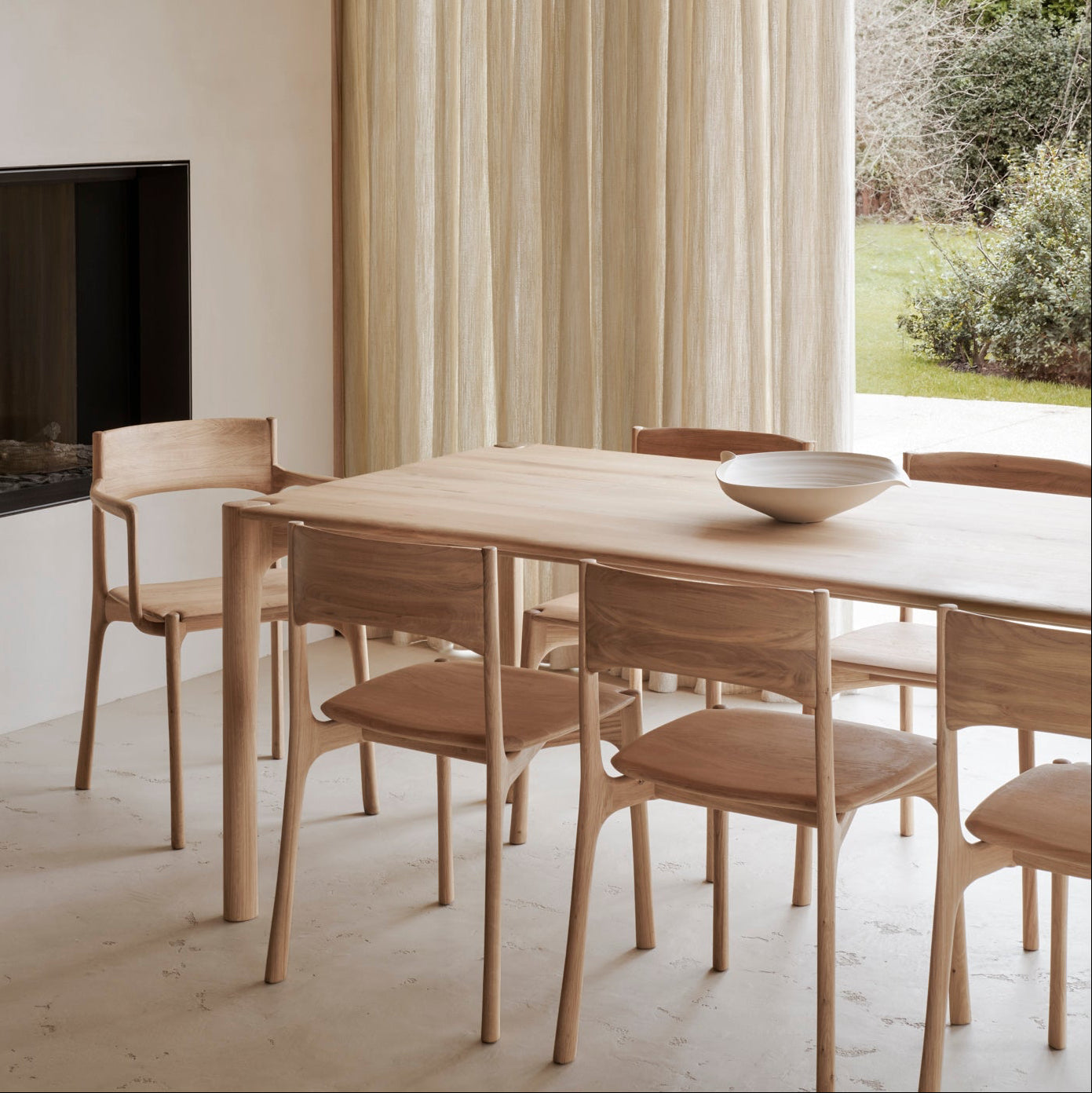 Ethnicraft Pi Dining Chair in oak styled in a dining room