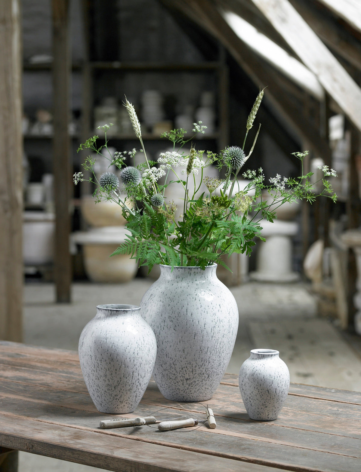 Knabstrup Vase in white and gray, styled in an interior setting, glazed earthenware