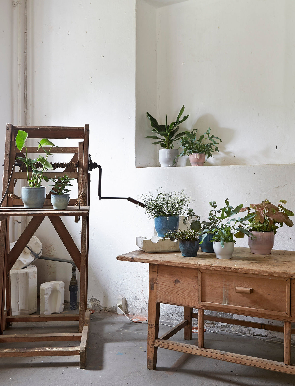 Knabstrup flowerpots in several glazes, styled in an interior setting, glazed terracotta