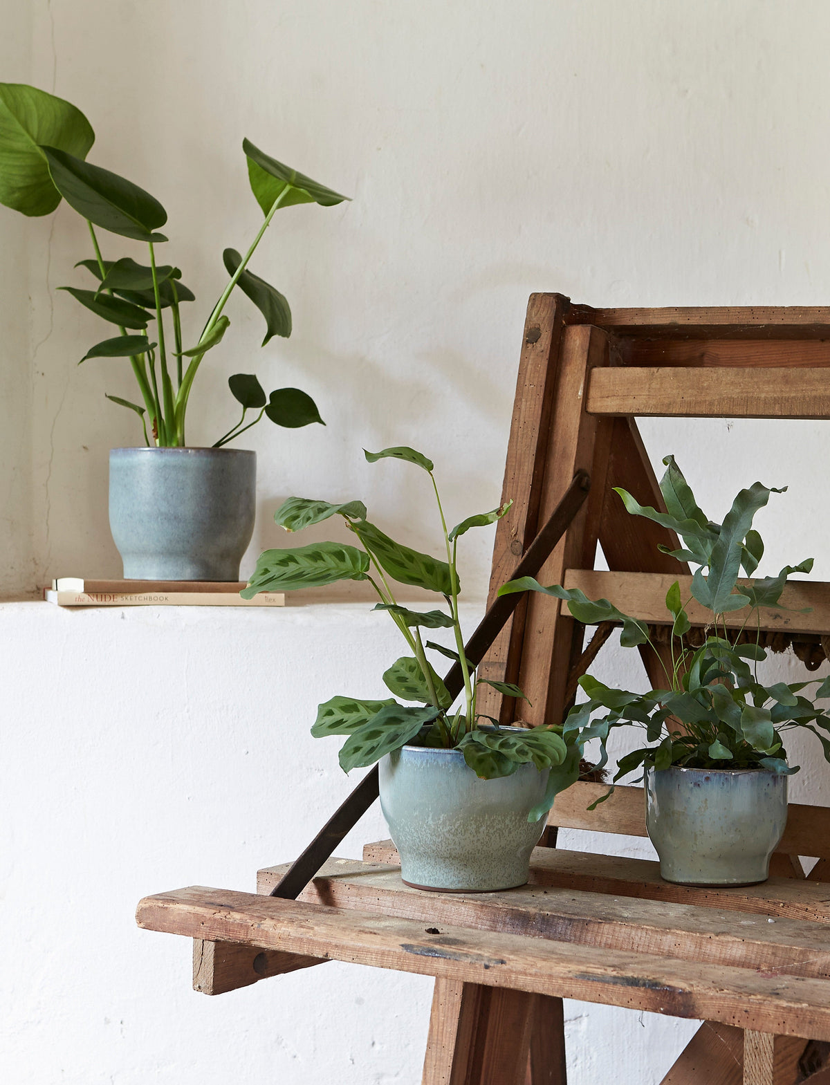 Knabstrup Flowerpot in mint, styled in an interior setting, glazed terracotta
