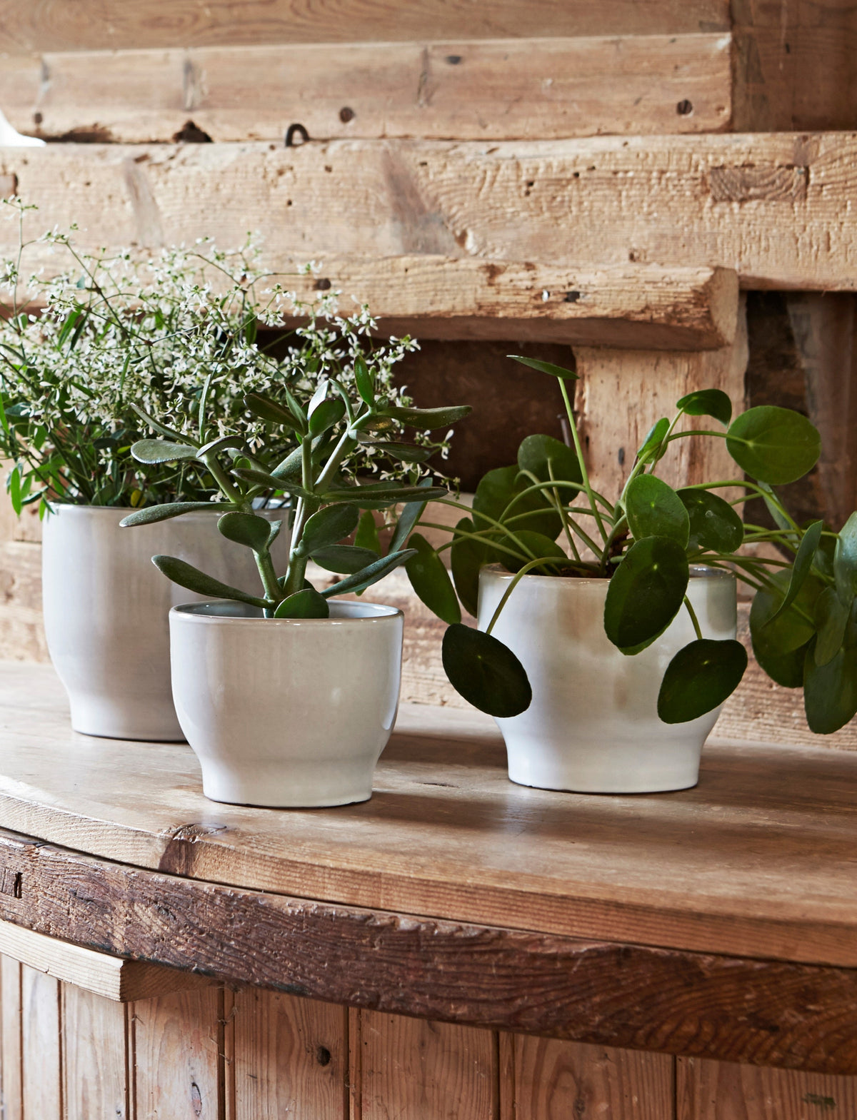 Knabstrup Flowerpot in white, styled in an interior setting, glazed terracotta