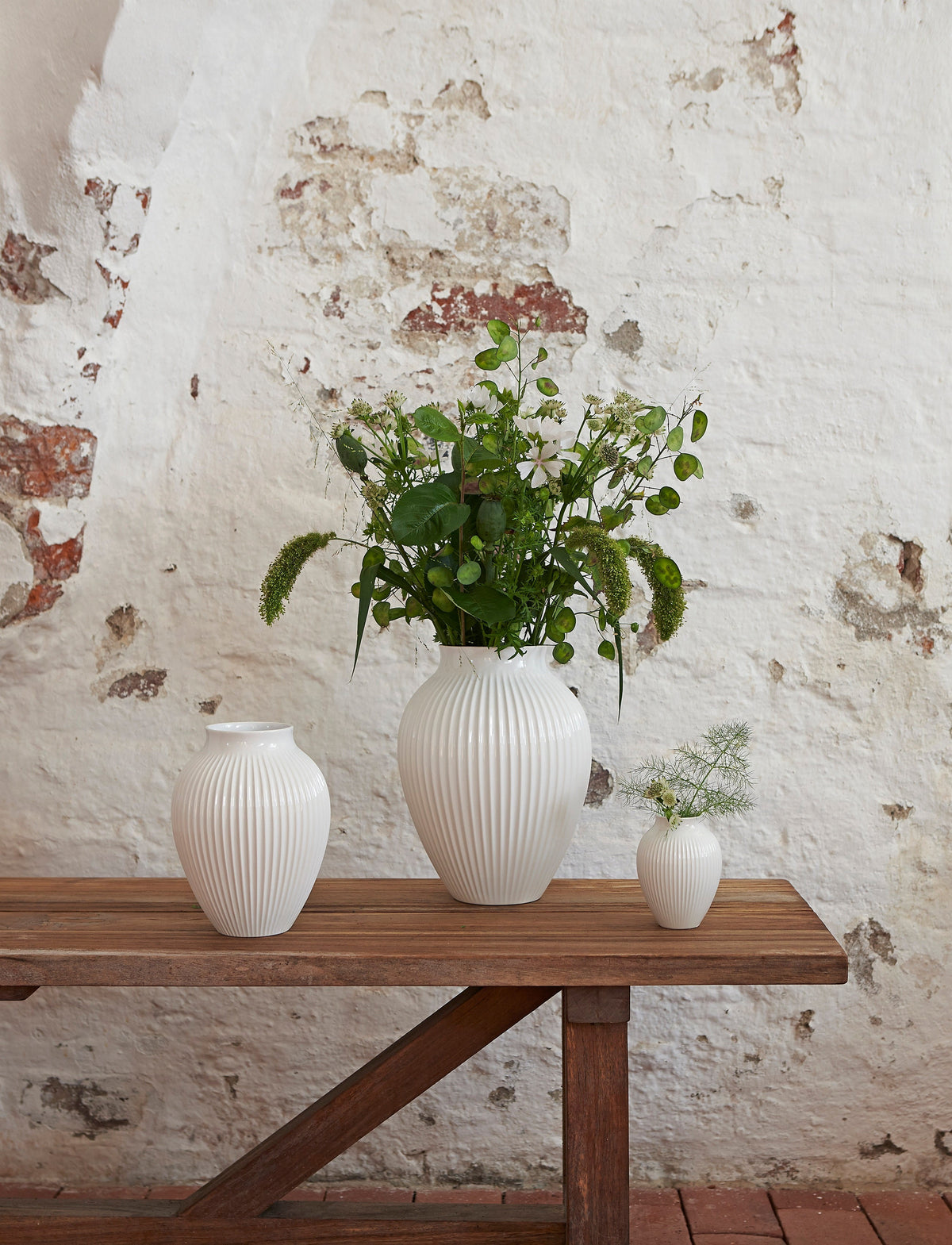 Knabstrup Ripple Vase in white, styled in an interior setting, glazed earthenware
