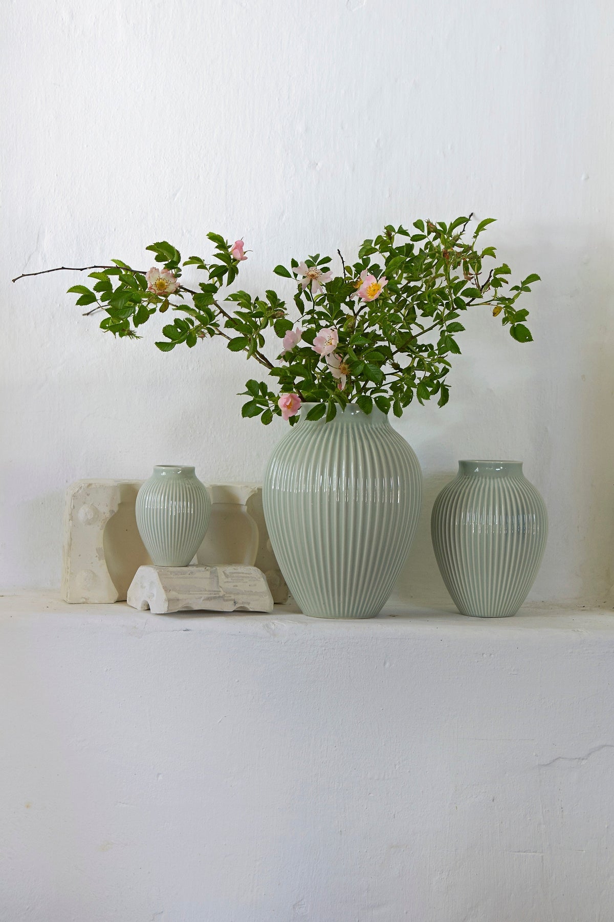 Knabstrup Ripple Vase in mint, styled in an interior setting, glazed earthenware
