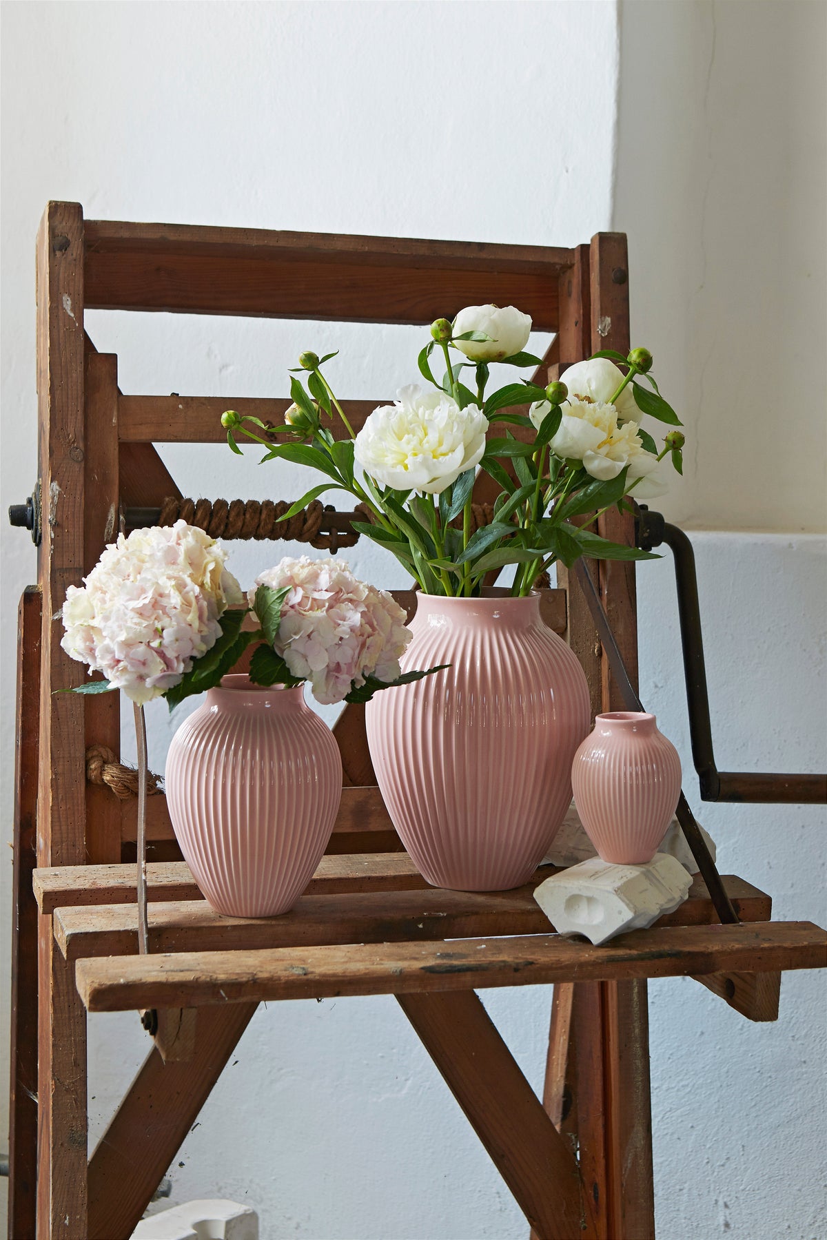 Knabstrup Ripple Vase in pink, styled in an interior setting, glazed earthenware