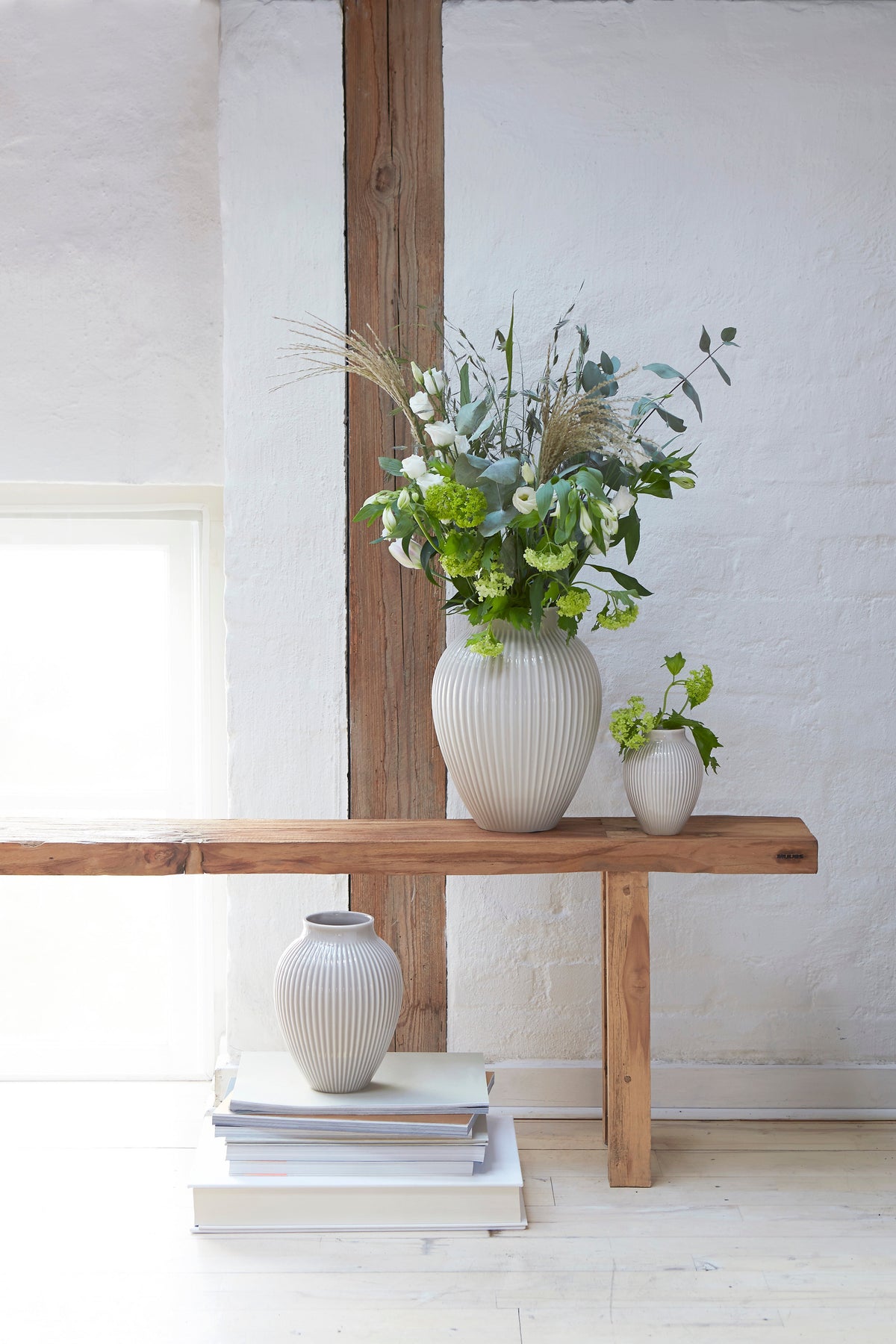 Knabstrup Ripple Vase in light gray, styled in an interior setting, glazed earthenware