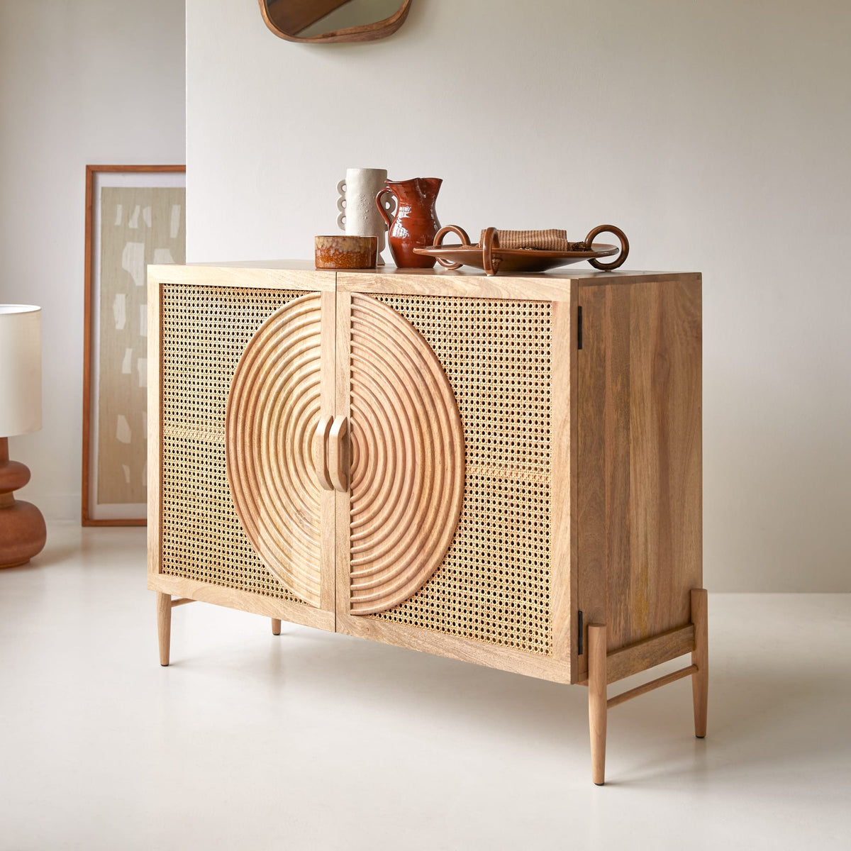 Tikamoon Sina mango and rattan sideboard, front view with doors closed