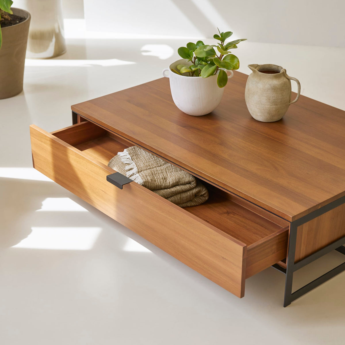 Tikamoon Urban acacia coffee table, view of the open storage drawer